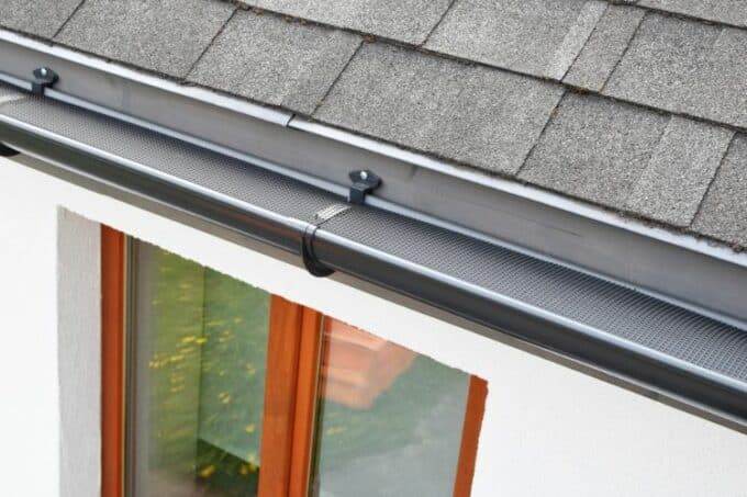 Gutter Guards vs. Gutter Cleaning - Which Is Better For Your Home? gutter guards vs. gutter cleaning